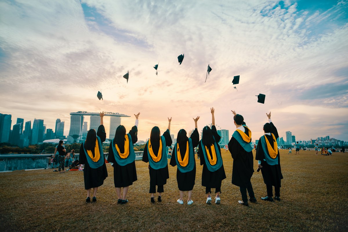 Graduates celebrating together on campus